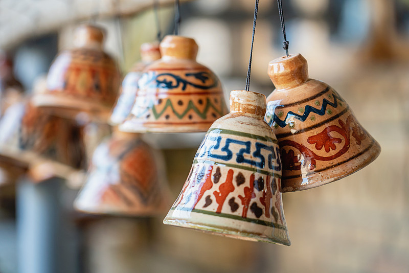 Detail,of,typical,handcrafted,ceramic,bells,,traditional,uzbek,ceramics.,Selective,Focus.,Handicraft,in,Bukhara,-,Buxoro,-,Бухорo,,Silk,Road,,Khorezm,Region,,Uzbekistan,,Central,Asia.