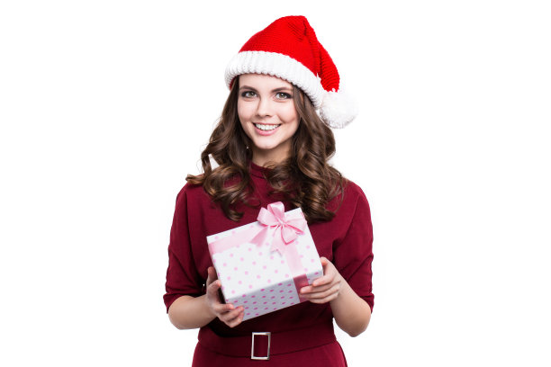 妇女在圣诞助手帽子与礼品盒