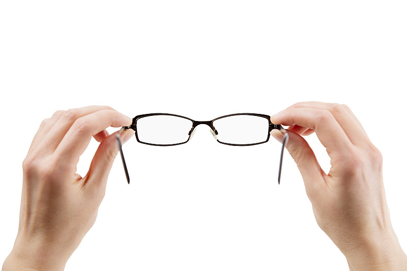 Hands,holding,eyeglasses,–,Isolated,with,clipping,path