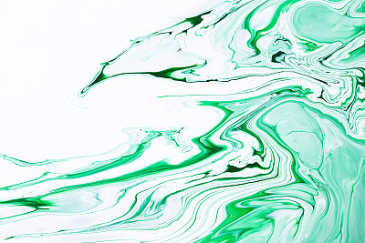 流体艺术纹理。抽象背景与虹彩涂料效果。液体丙烯酸图片与流动和飞溅。混合油漆背景或海报。翠绿色和白色溢出的颜色。