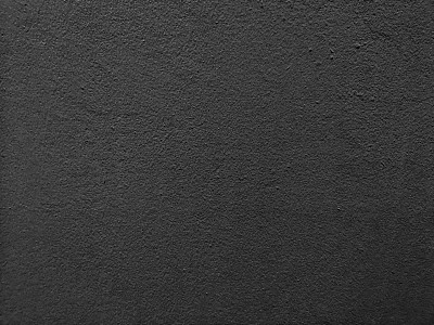 水泥墙面饰面光滑抛光，表面纹理混凝土材质为背景，抽象黑色深灰色，楼面建筑为建筑，纸质贺卡为贺卡