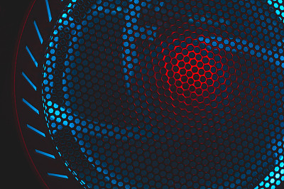 电脑风扇的彩光透过防护网的小孔照射进来。照明在黑暗中发光。抽象的背景。游戏PC的Led照明