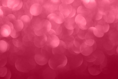 A magenta abstract bokeh bubble background – 2023 color of the year