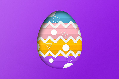 紫色和黄色的剪纸形成了复活节彩蛋的图案。覆盖纸