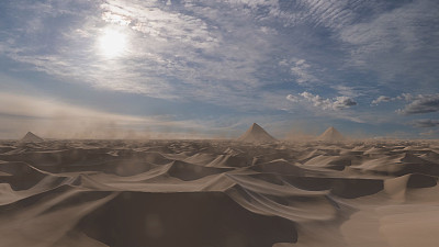 沙漠沙丘与金字塔形状的山脉，空中