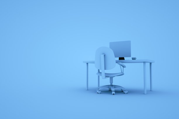 蓝色背景下办公桌上的电脑显示器