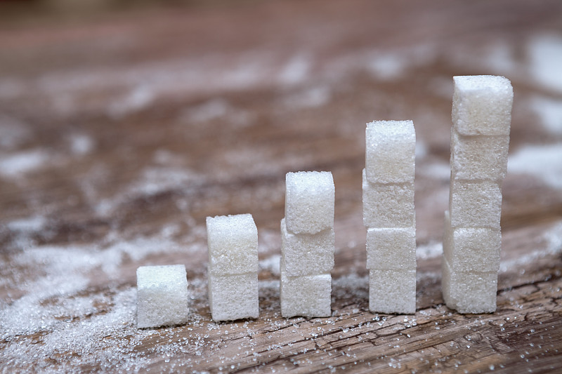 Stacks,of,white,sugar,cubes,–,diabetes,and,high,blood,sugar,risk,concept